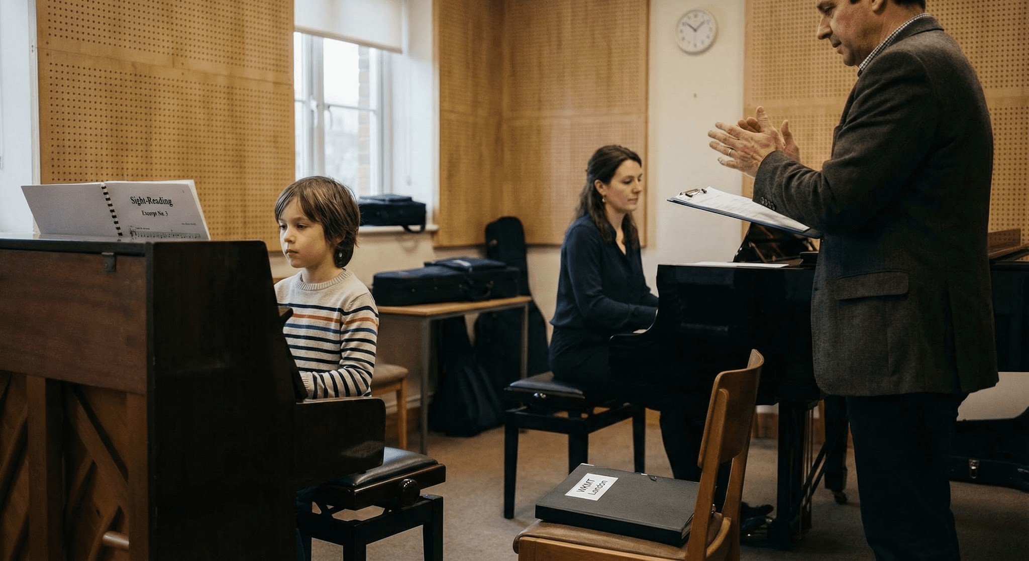 Parent and child outside a London school entrance on audition morning, holding a folder of sheet music and a checklist.