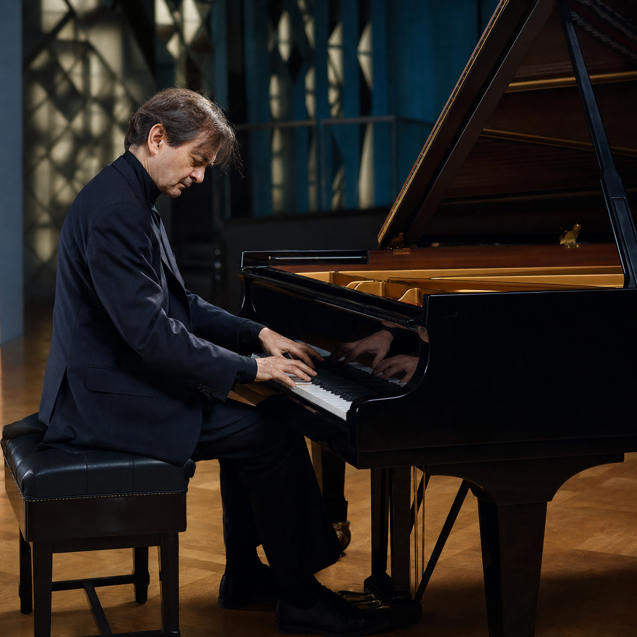 Pierre-Laurent Aimard performing Ligeti-inspired layered rhythms at a grand piano